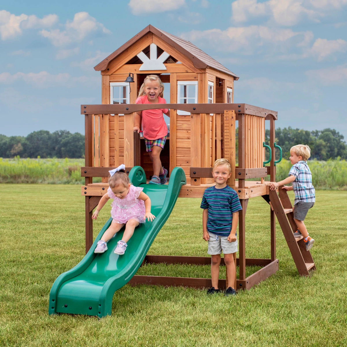 Backyard Discovery Echo Heights Cedar Wooden Elevated Kids Playhouse with Wave Slide, Play Kitchen, and Deck